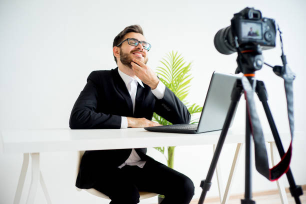 istock Smiling video blogger 691178226