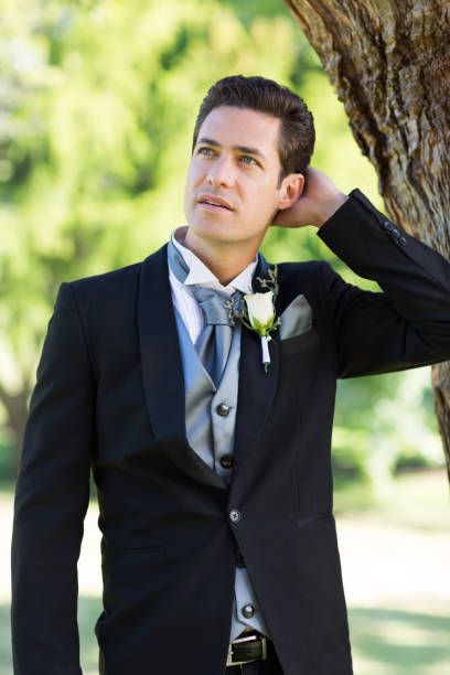 istock Nervous groom looking away at garden 691186532
