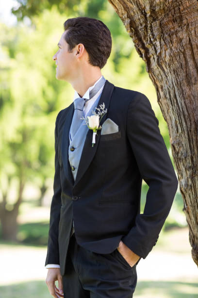 istock Bridegroom looking away in garden 691186684