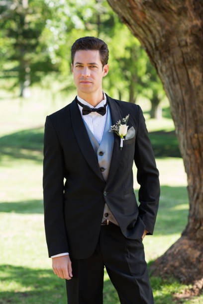 istock Confident bridegroom in tuxedo at garden 691186768