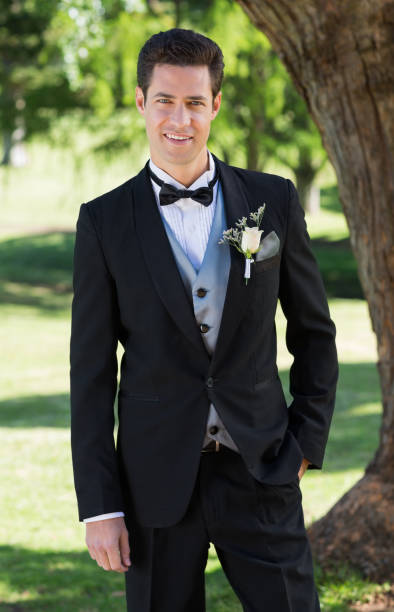istock Handsome groom standing in garden 691186780