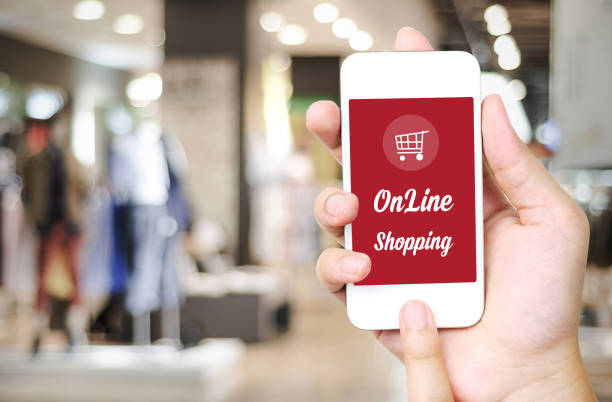 istock Shopping on line concept on smart phone screen over blur store background, e-commerce, business and technology concept 691186836
