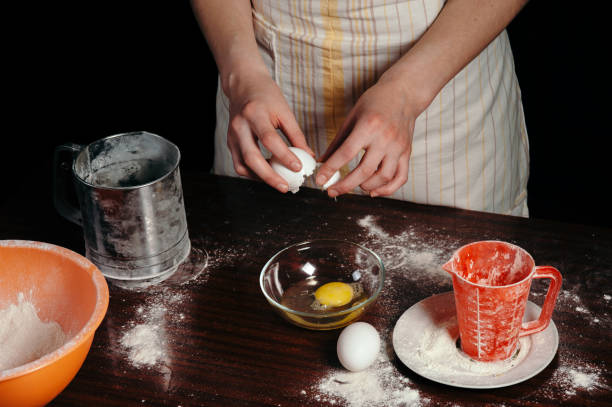 istock Girl in an apron in a dark kitchen. 691188114