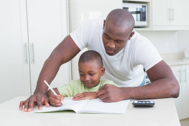 istock Happy smiling father working with his son 691207638