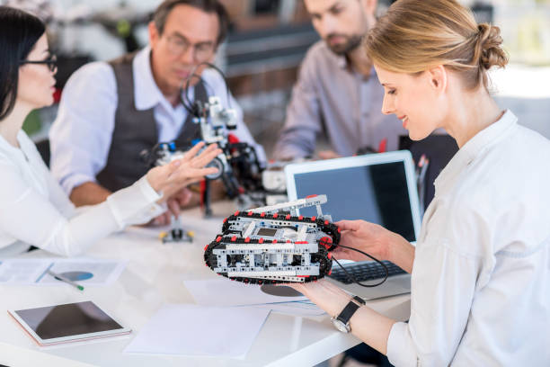 istock Cheerful concentrated group of scientists working in office 691208186