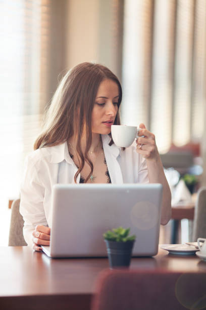 istock Young woman working on a laptop 691214484
