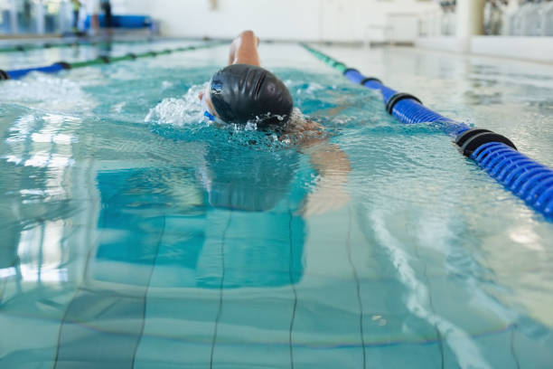 istock Fit swimmer doing the front stroke in the swimming pool 691215394