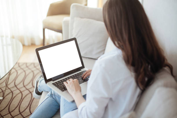 istock Cropped image of woman using laptop with blank screen 691217946