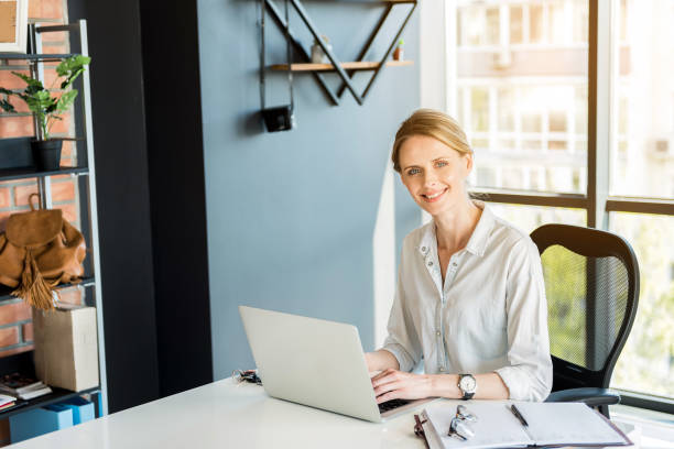 istock Professional attractive employee working in office cheerfully 691218628