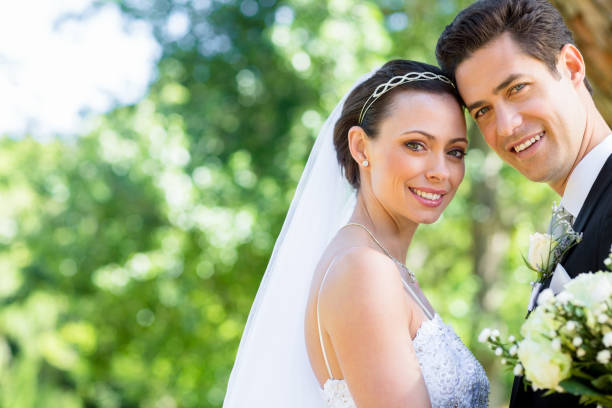 istock Loving bride and groom in garden 691218654