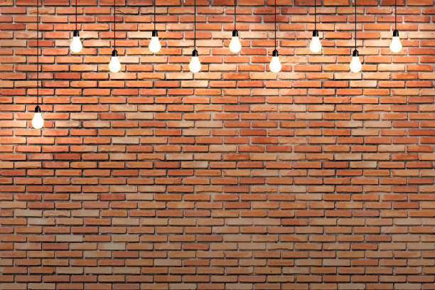 brick wall with bulb lights lamp. nice brick show room with spotlights.