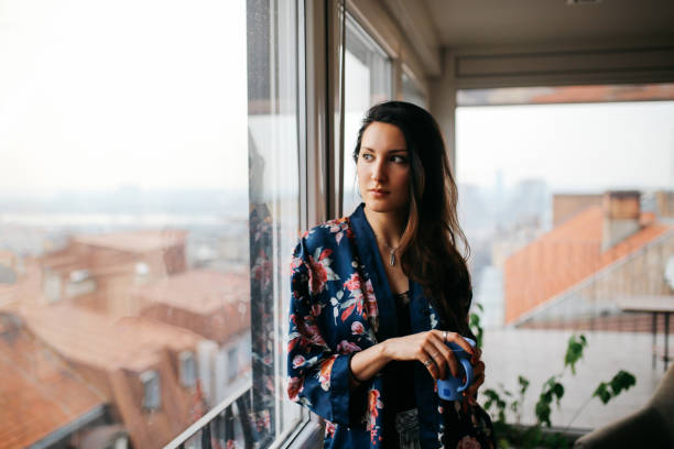 istock Young woman relaxing at home 691226046