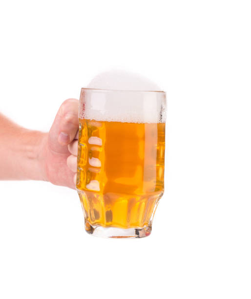 istock Mug of beer with foam in hand. 691228412