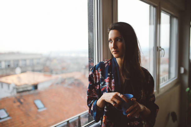 istock Young woman relaxing at home 691229008