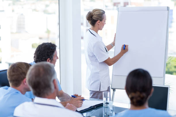 istock Team of doctors having brainstorming session 691229254