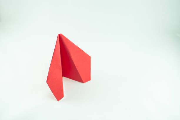 istock Red paper plane on a white background, isolated. 691235360