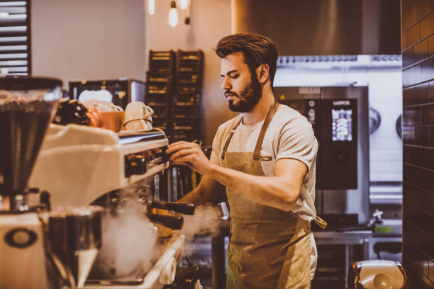 istock Young barista is making a coffee in cafe shop 691244154