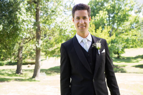 istock Confident groom smiling in garden 691245612
