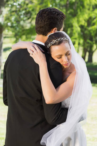 istock Bride embracing groom on wedding day 691248832