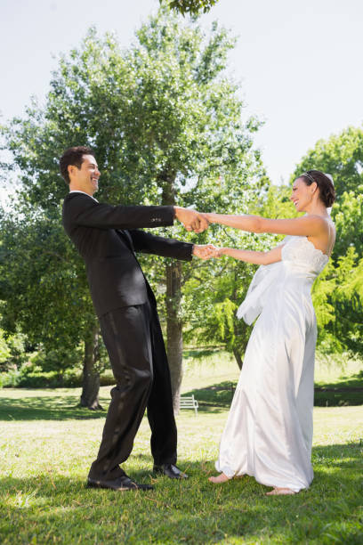 istock Newly wed couple enjoying in park 691248958