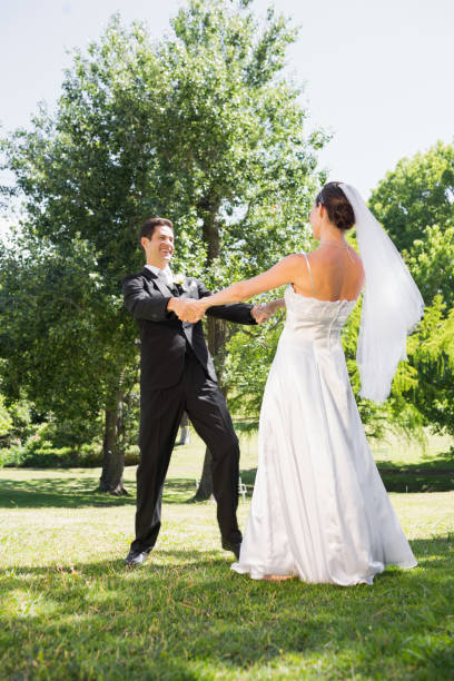 istock Bride and groom enjoying in park 691248988