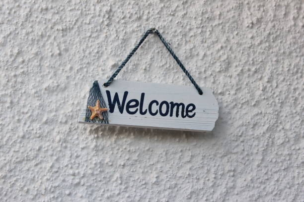 Wood welcome sign hanging on wall