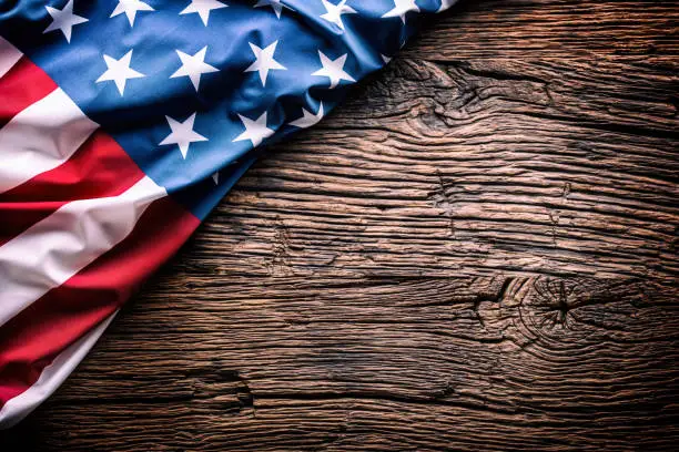 Photo of American  Flag. Usa flag on rustic oak board diagonally