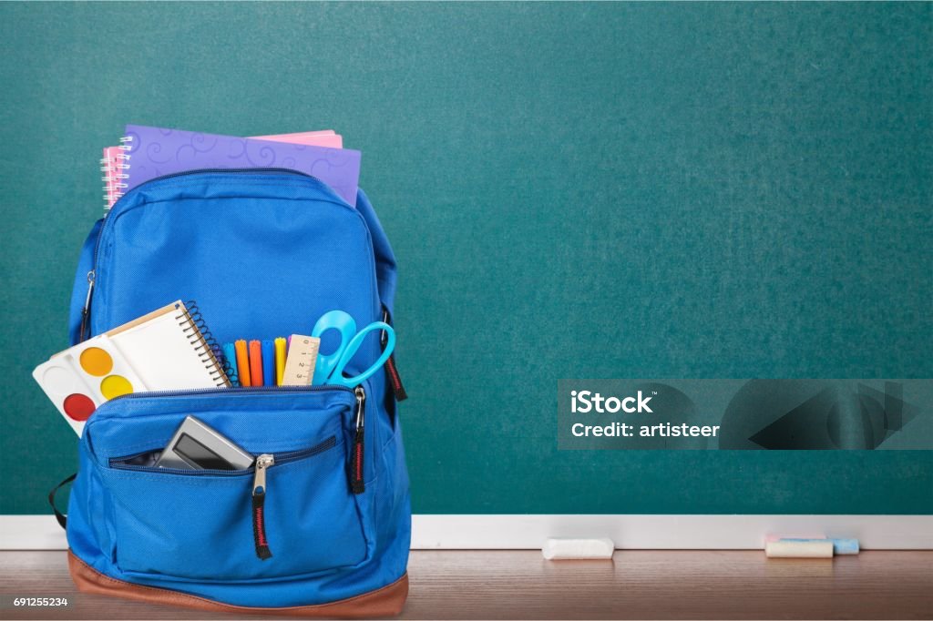 School. Blue School Backpack  on   background. School Supplies Stock Photo