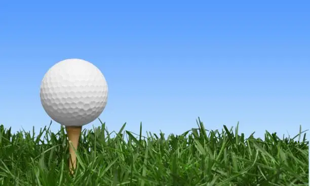 Golf ball on tee on golf course