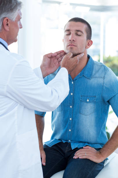 istock Doctor examining his patients ganglion 691262130