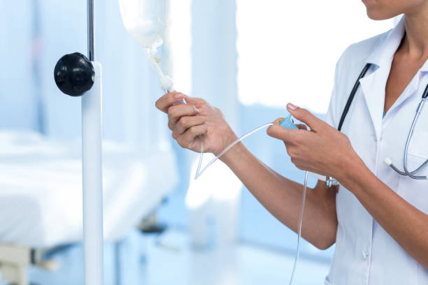 istock Nurse connecting an intravenous drip 691263362
