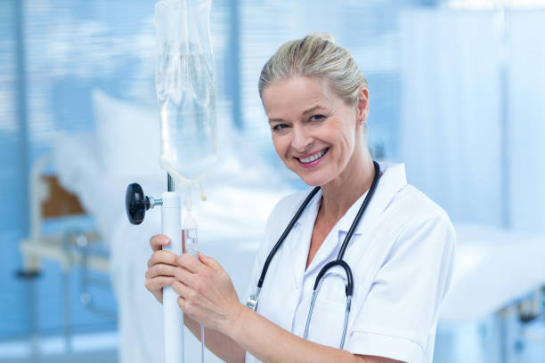 istock Nurse connecting an intravenous drip 691263544