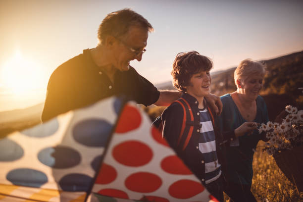 istock Grandparents with grandson in nature 691275762