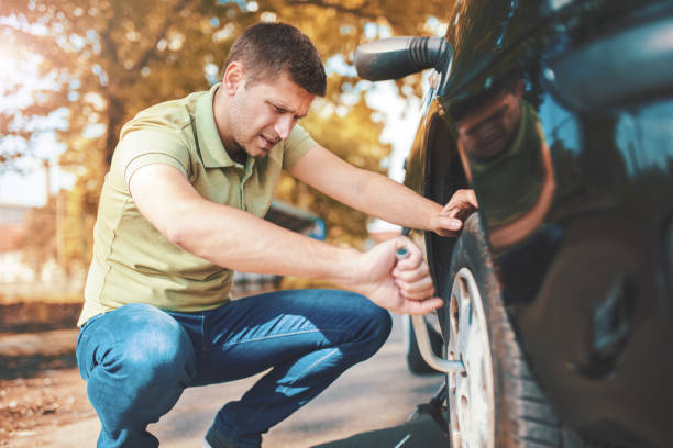 istock Problem with a car. A broken car on the road. Changing wheel 691277266