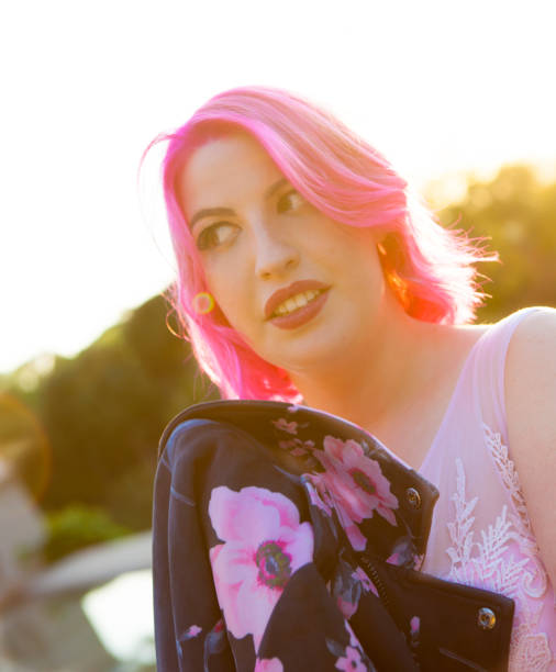 istock Beautiful young woman in pink 691280558