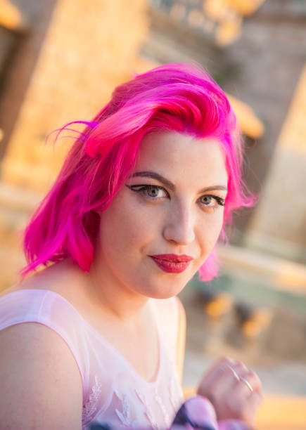 istock Beautiful young woman in pink 691282580