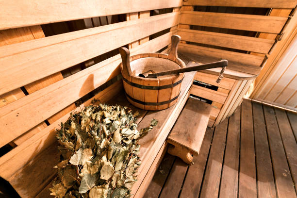 Empty wooden sauna room with ladle, bucket ready to be used Empty wooden sauna room with ladle, bucket ready to be used. swedish sauna stock pictures, royalty-free photos & images