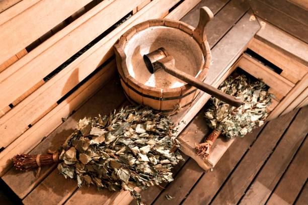 Empty wooden sauna room with ladle, bucket ready to be used Empty wooden sauna room with ladle, bucket ready to be used. swedish sauna stock pictures, royalty-free photos & images