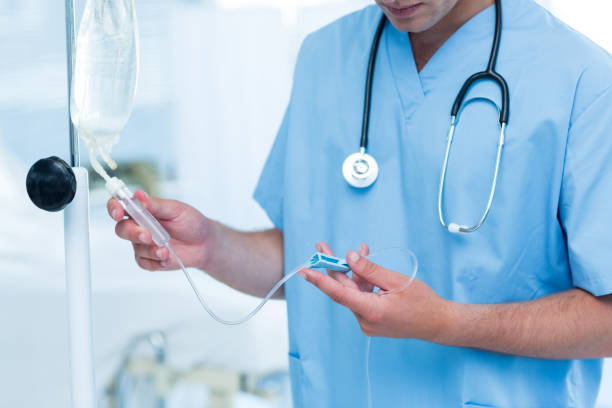 istock Doctor examining intravenous drip 691290946