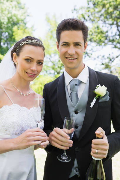 istock Newlywed couple having champagne 691294582