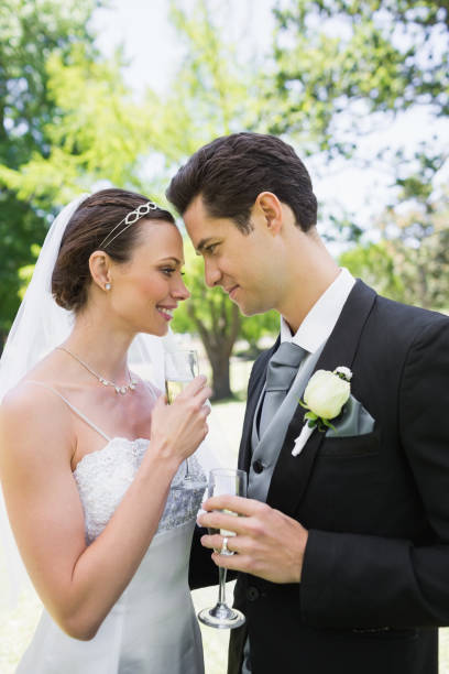 istock Romantic bride and groom in park 691295008