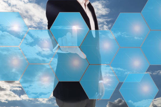 istock businessman in dark gray suit making decision in business by pushing on one hexagonal button. Businessman hand pushing digital screen 691297156