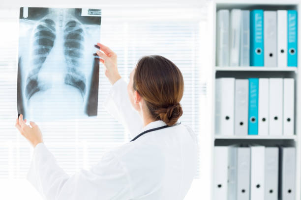 istock Female doctor studying Xray 691297882
