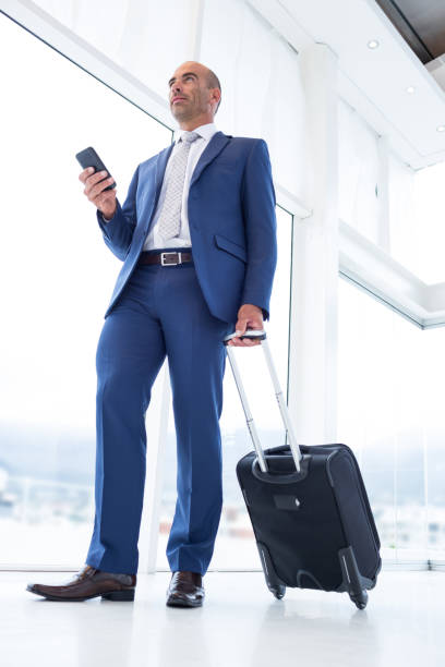 istock Businessman texting with his smartphone 691308476