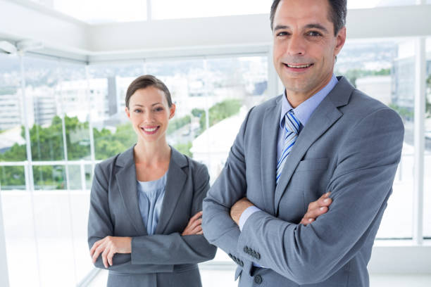 istock Business colleagues smiling at camera 691308558