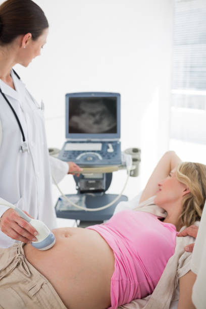 istock Doctor using ultrasound on pregnant woman 691312252