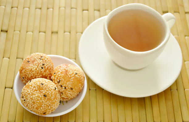 istock fried glutinous ball topping sesame stuffed bean with tea 691319456