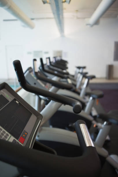 istock Row of cross trainer machines 691326262