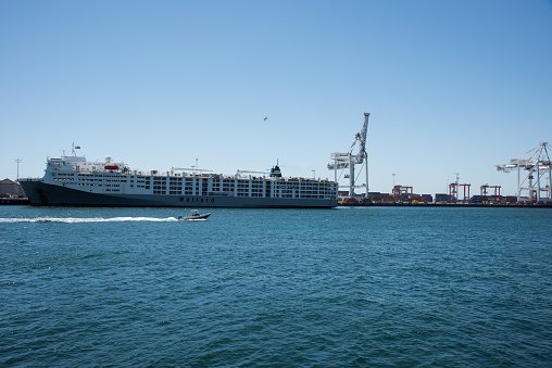Las Palmas de Canaria, Spain: 11/05/2023-Las Palmas de Canaria island commercial harbour port with cranes and containers.