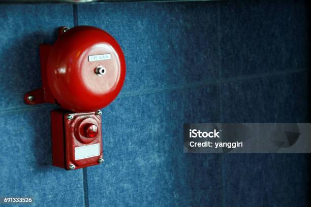 Fire Alarm On The Wall Stock Photo - Download Image Now - Alarm, Bell, Accidents and Disasters